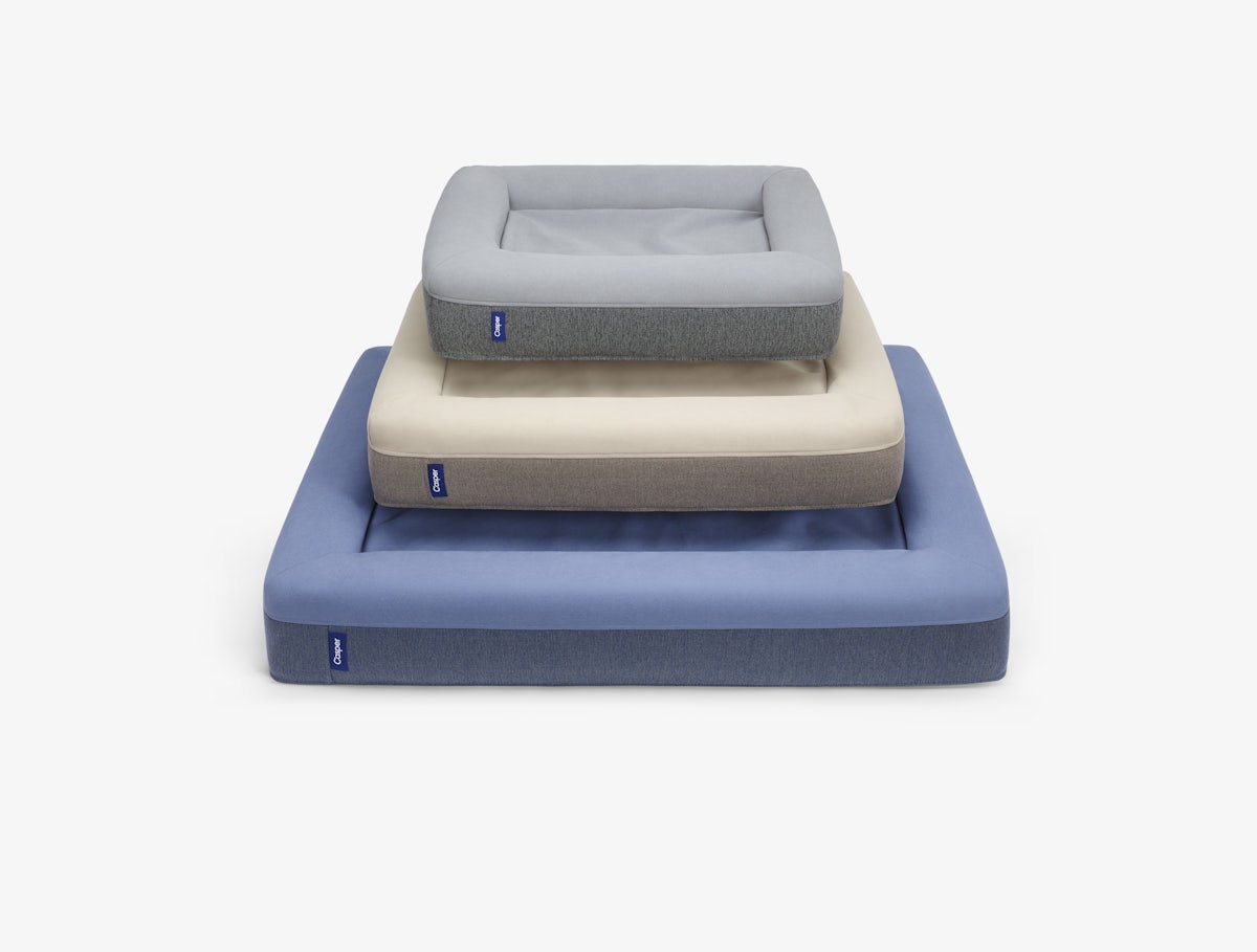 Three sizes of the Casper Dog Bed stacked on top of each other